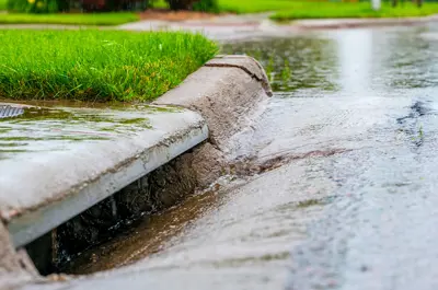 water running into a street drain system