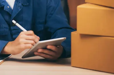 business owner writing in a notepad