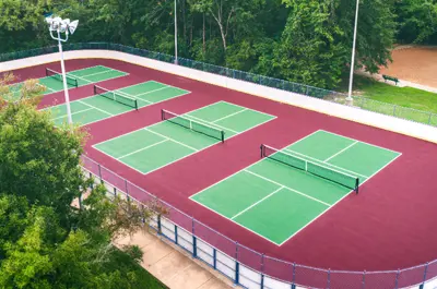aerial view of pickleball courts in a public park.