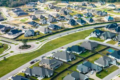 aerial view of a subdivision filled with homes