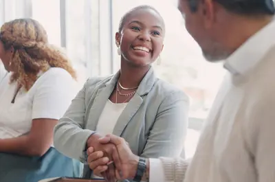 several job applicants greeting each other waiting to interview