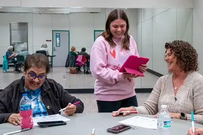 Parks & Recreation laughing with seniors during a social activity session