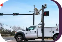 City of Bryan employee performing maintenance on a traffic signal light