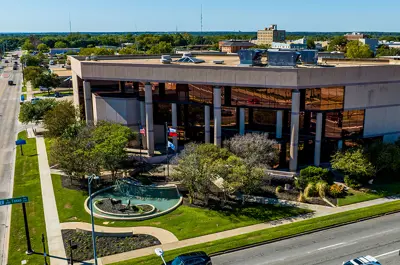 view of Bryan City Hall and the intersection of E 29th St and Texas Ave.